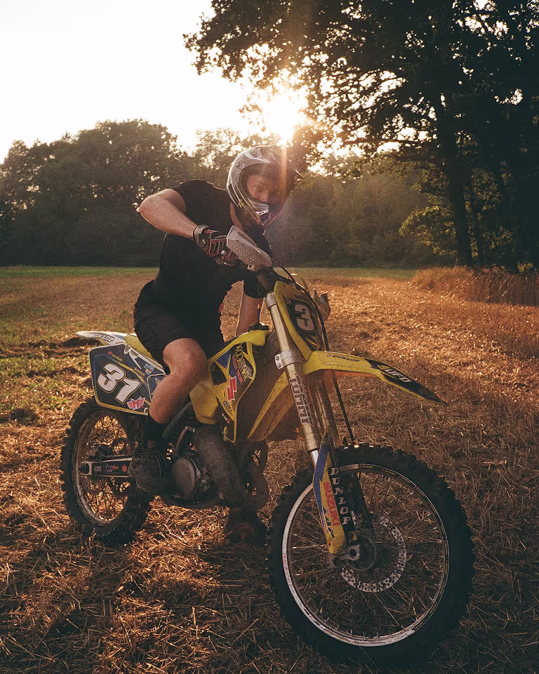 Adventurous freelance designer and Webflow developer Jaroslav Dlask riding a dirt bike.