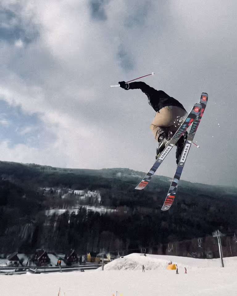 Adventurous freelance designer and Webflow developer Jaroslav Dlask jumping on freeskis.