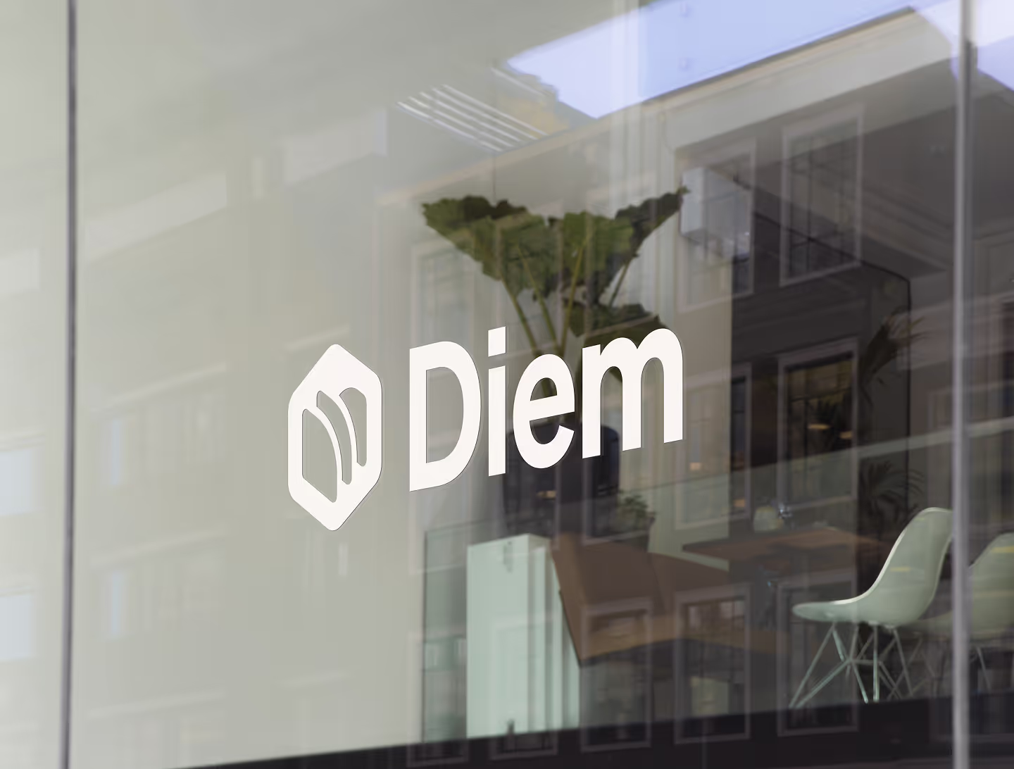 Startup branding minimal logo sticker on an office for a brand called Diem.